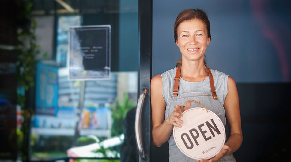 Small Business Owner Holding Open Sign